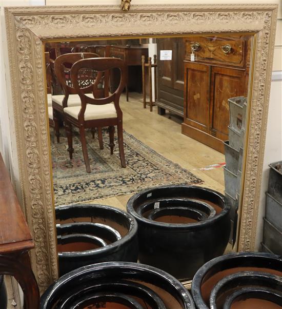 A bevelled wall mirror W.96cm